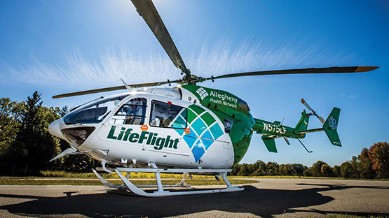 An AHN LifeFlight helicopter parked on a helicopter platform.