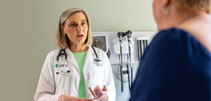 An AHN cardiovascular doctor discussing treatment with a patient.